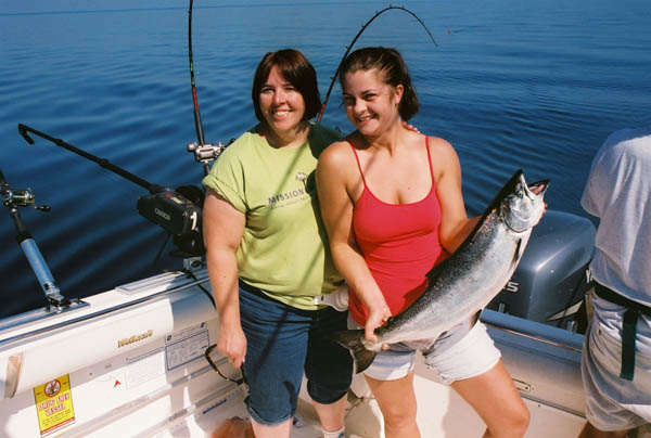 Kassie & Nancy with King Salmon - Leprechaun Fishing Charters on Lake Michigan